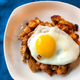 Illustration for article titled Turn leftover party chicken wings and potato skins into a crispy hash
